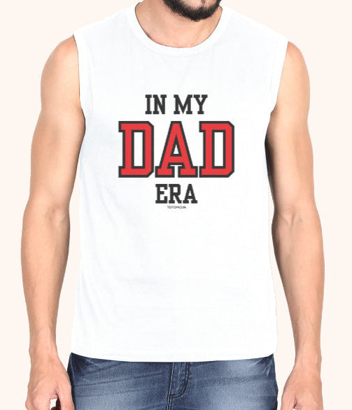 Man wearing a sleeveless shirt with 'IN MY DAD ERA' text on a plain background