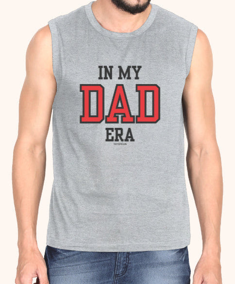Man wearing a sleeveless gray shirt with 'IN MY DAD ERA' text on a white background