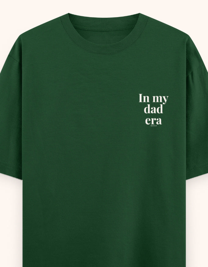 Green t-shirt with a white logo on a white background