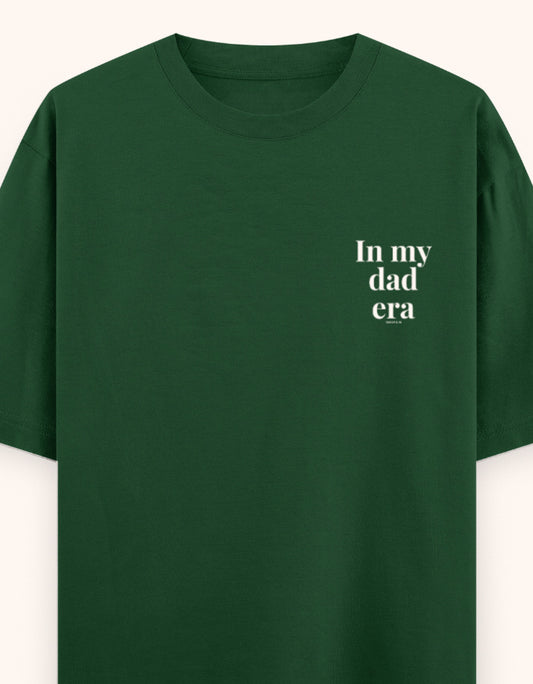 Green t-shirt with a white logo on a white background